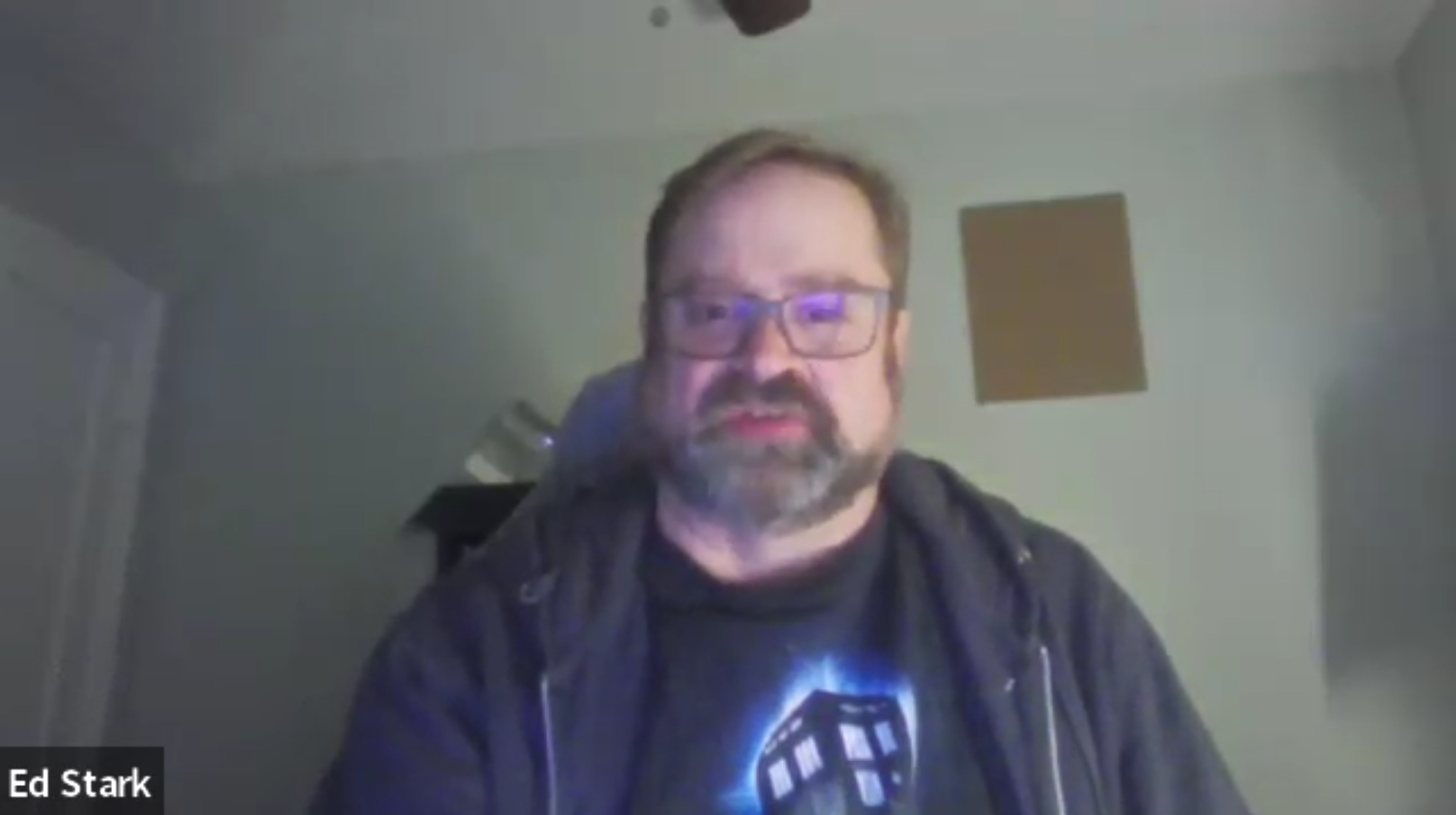 Ed Stark seated in front of his computer giving an interview.